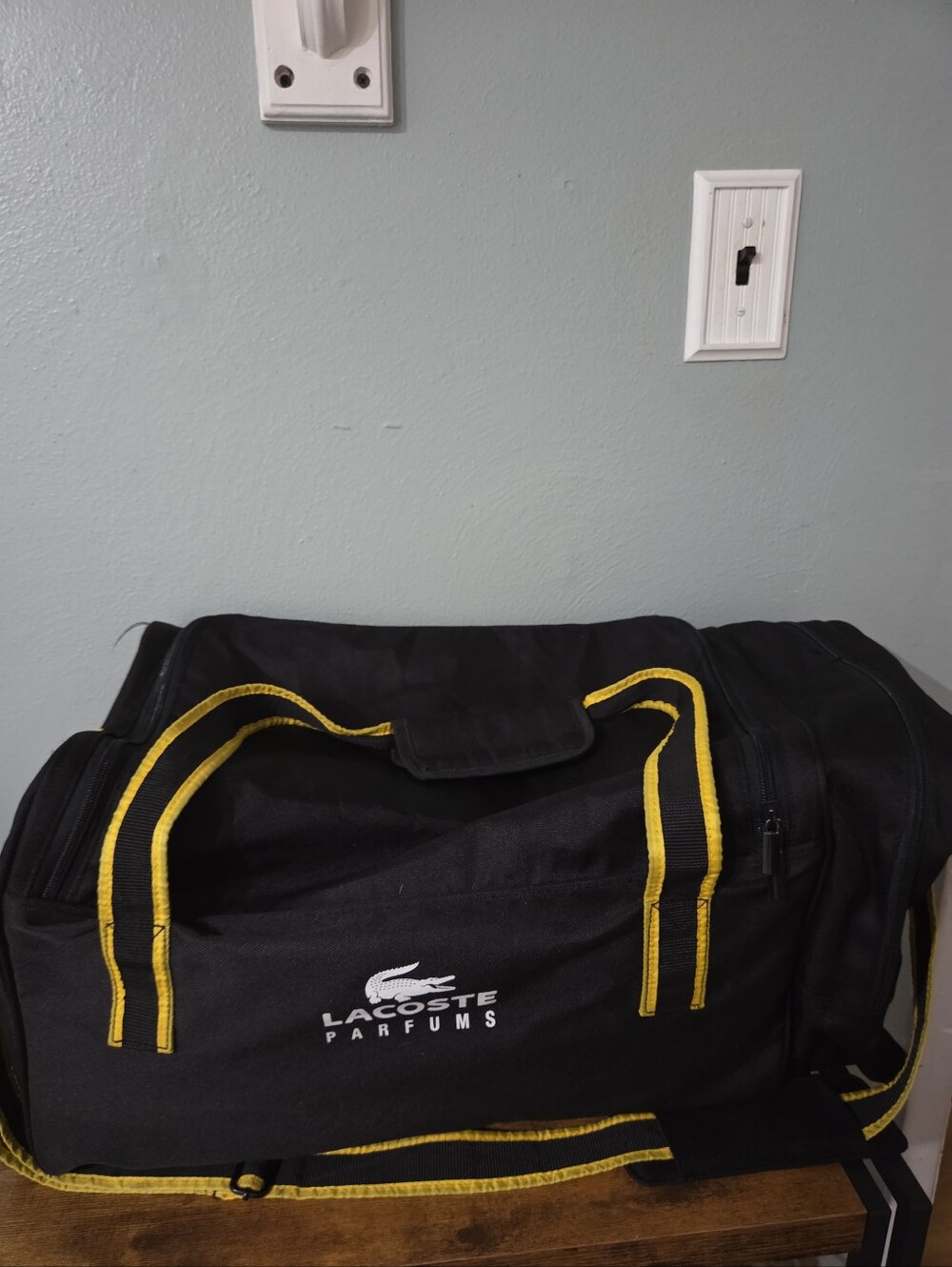 Lacoste Black Duffel Bag with Yellow Trim